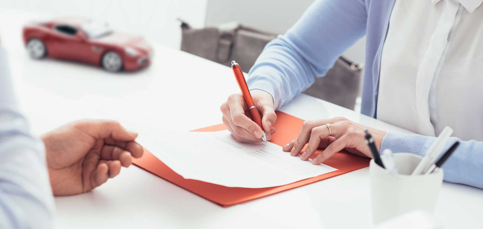 Person Signing Paper